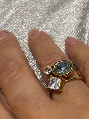 Gold Ring with Blue Oval Gem and Clear Cubic Stones